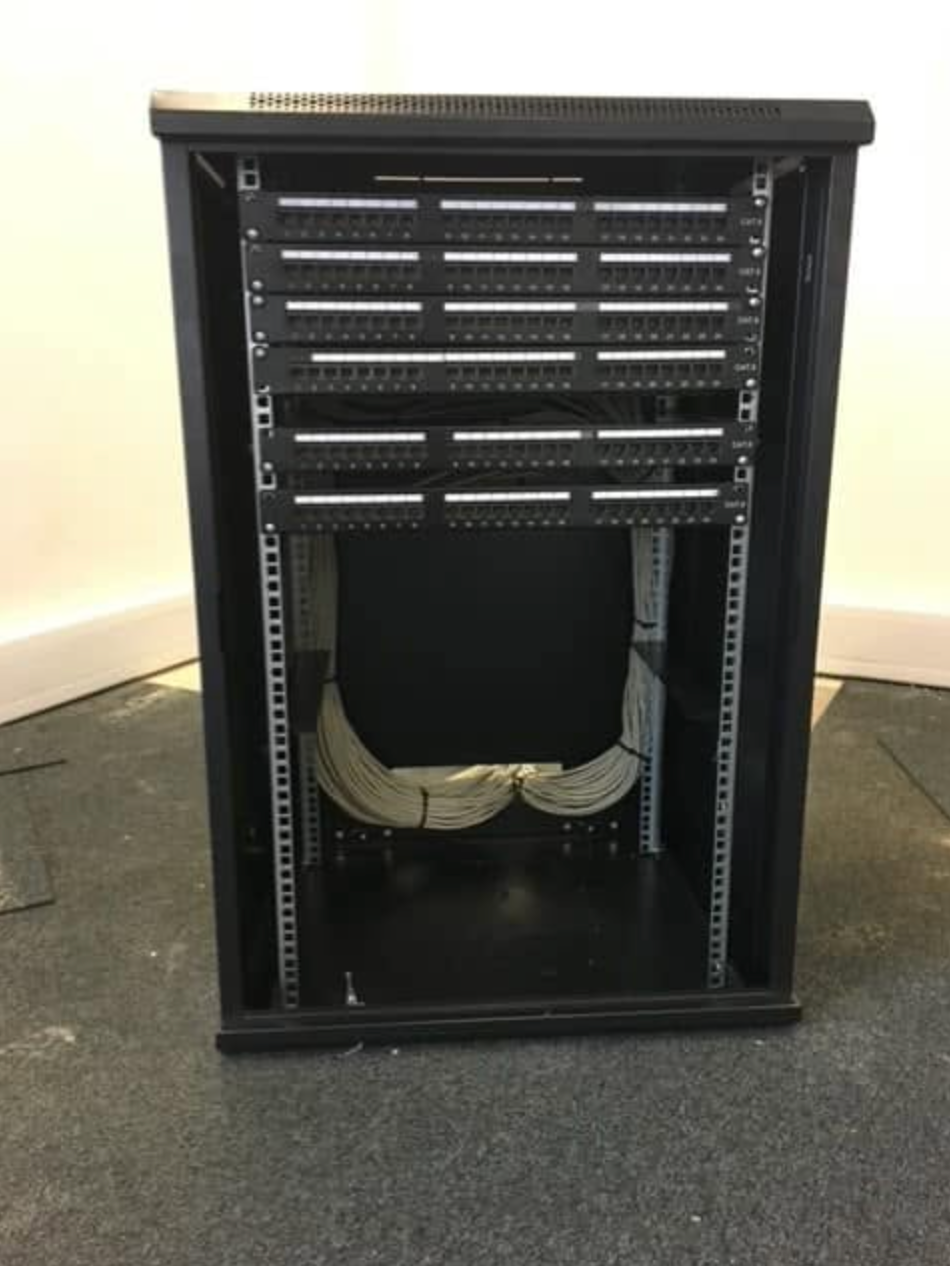 Screenshot 2026-10-07 at 16.26.36 Data cabinet with patch panels and network cabling
