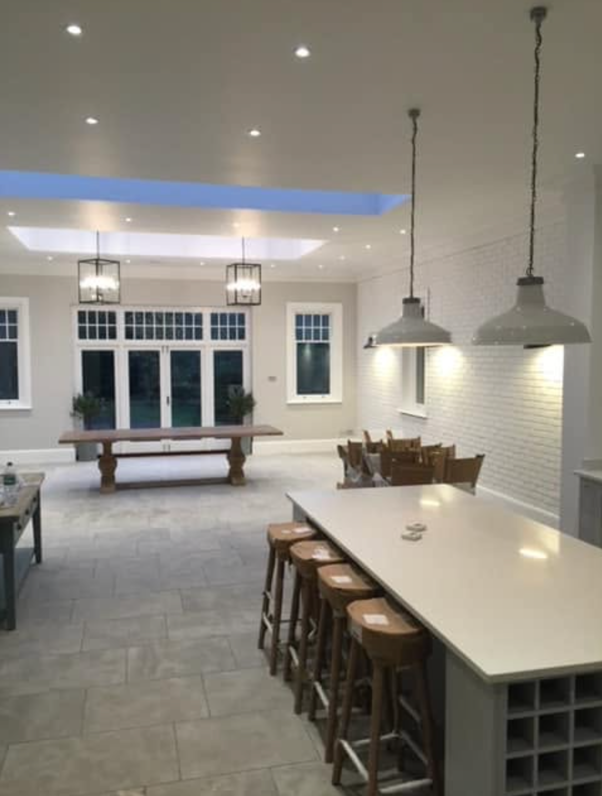 Screenshot 2026-10-07 at 16.27.32 Pendant lights and recessed lighting above a kitchen and dining area