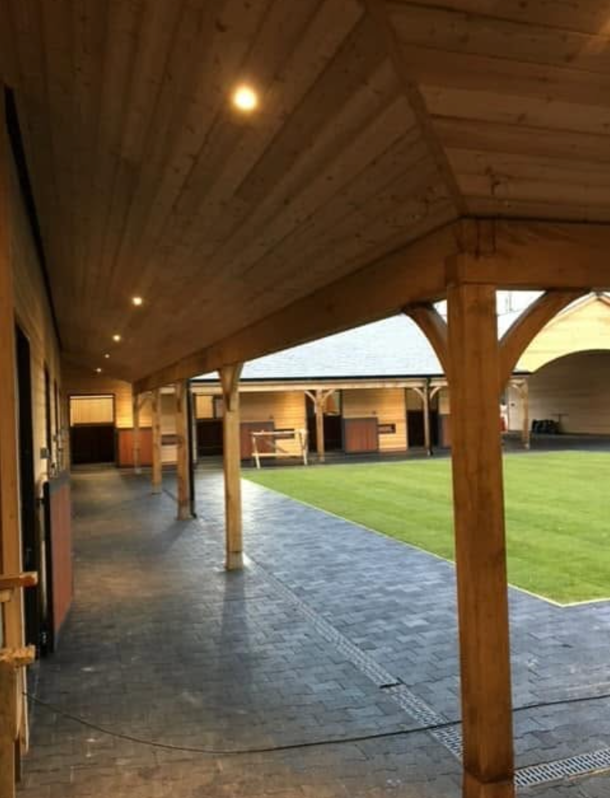 Screenshot 2026-10-07 at 16.27.43 Ceiling spotlights illuminating a covered timber walkway